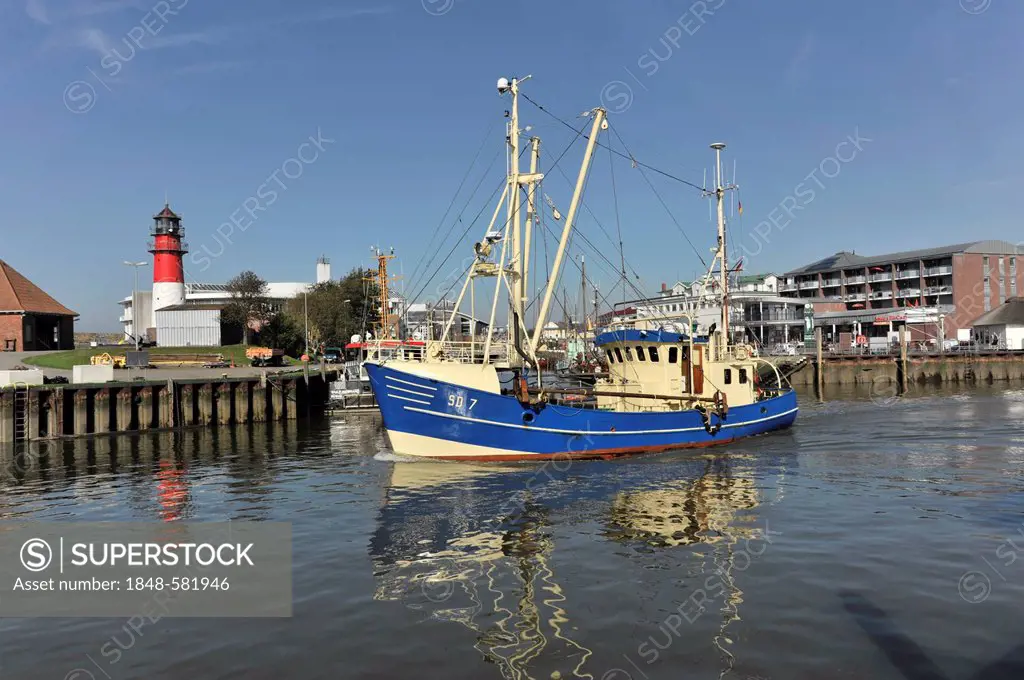 Shrimp cutter in the port of Buesum, with Buesum Lighthouse on the left, Schleswig-Holstein, Germany, Europe