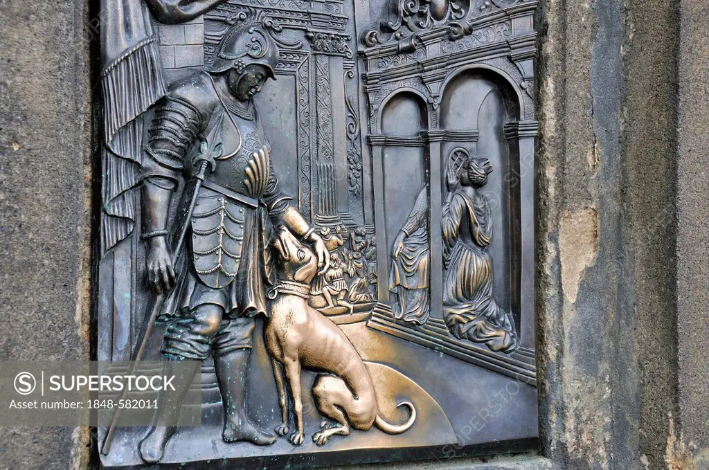 Bronze relief on the statue of St. John of Nepomuk, Nobleman with Dog, touching the dog brings good luck, Charles Bridge, Prague, Bohemia, Czech Repub...
