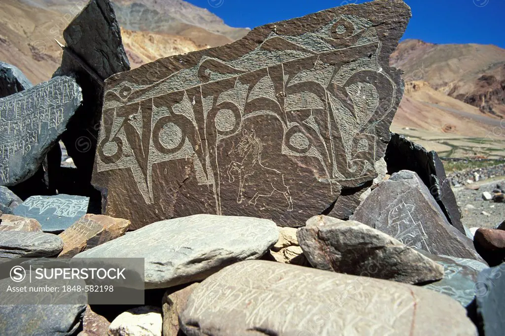 Prayer stone with the widespread Buddhist mantra Om Mani Padme Hum on it, Zanskar valley, Zanskar, Ladakh, Jammu and Kashmir, Indian Himalayas, northe...