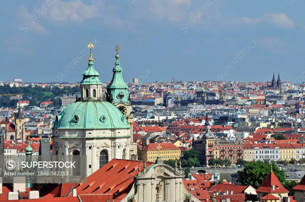 Panoramic view across the historic centre of Prague, UNESCO World Heritage site, with St Nicholas Cathedral, Prague, Bohemia, Czech Republic, Europe, ...