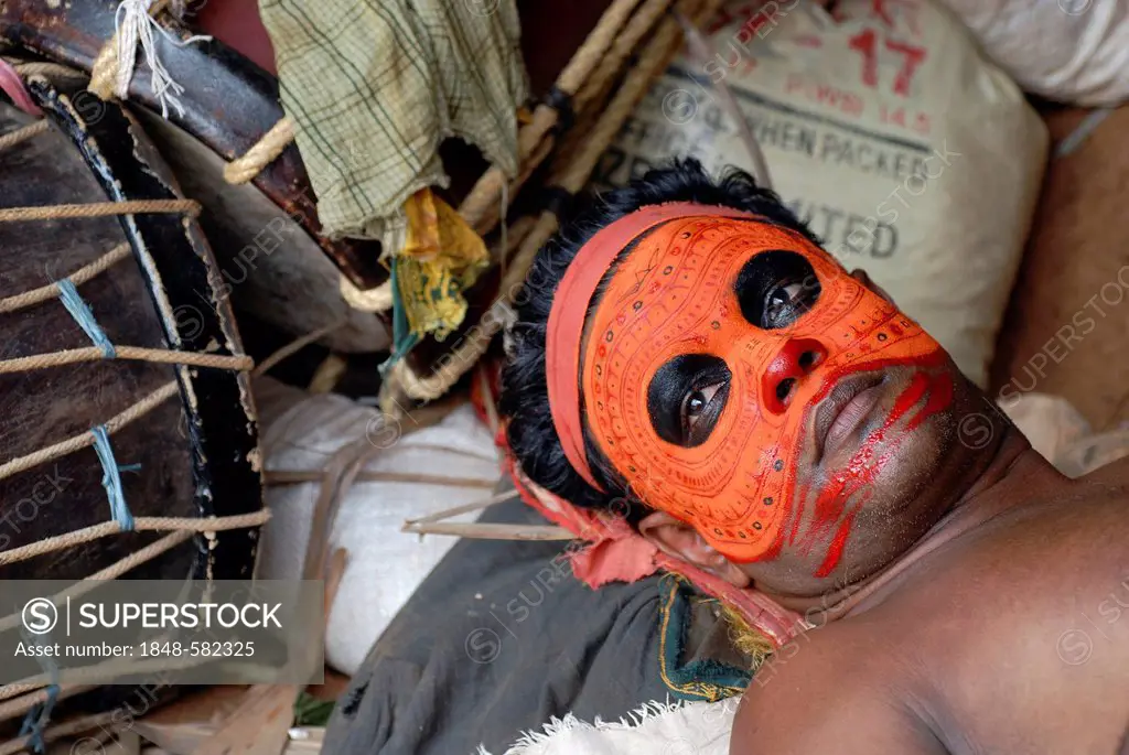 Theyyam performer, painted face, preparing for a ritual, near Kasargod, North Kerala, South India, Asia