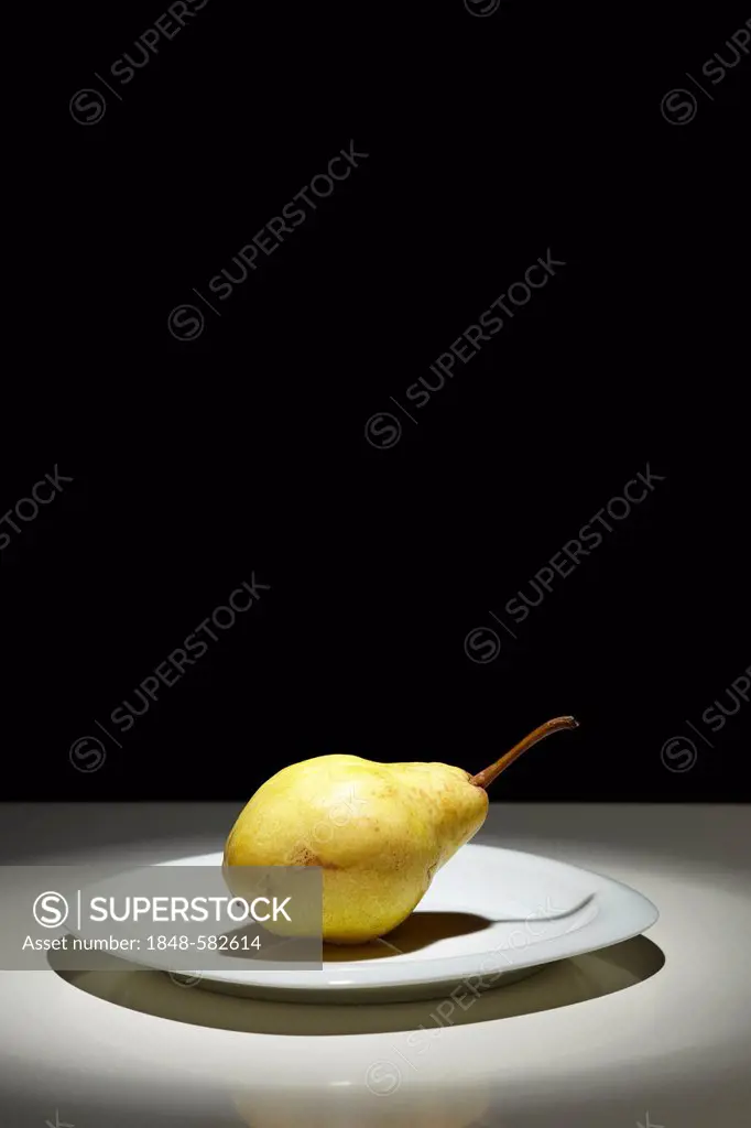 Pear (Pyrus communis) on a white plate