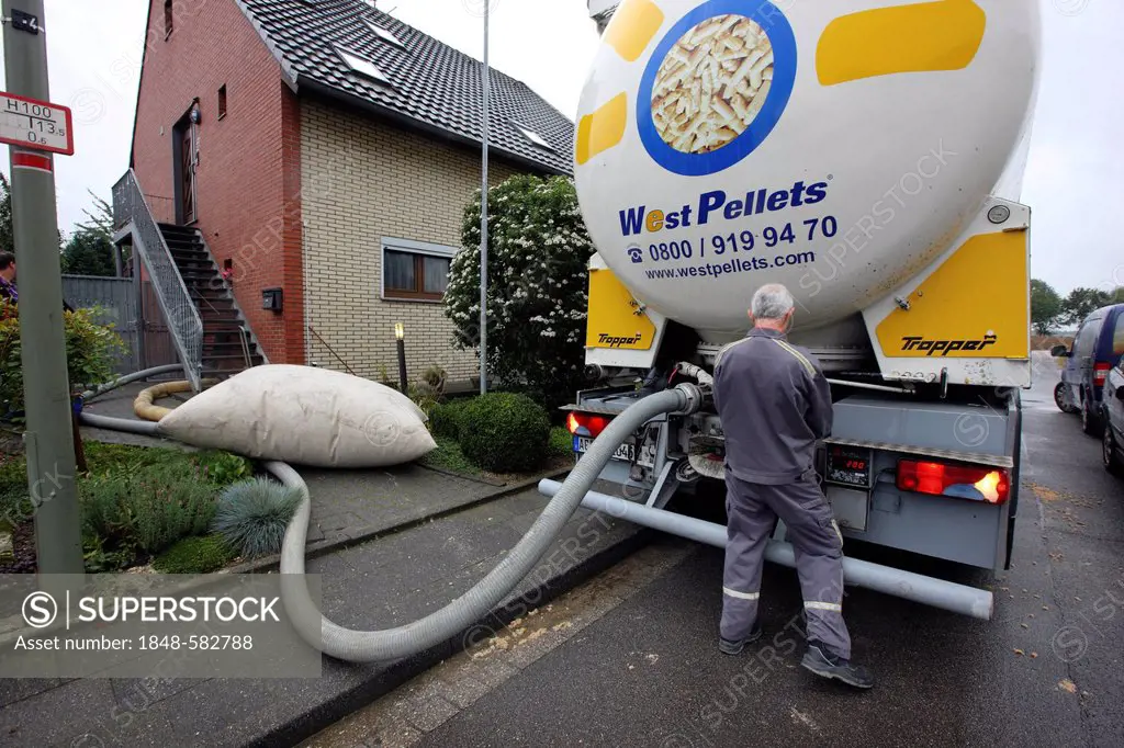 Tanker delivering wood pellets to a private house, Erkelenz, North Rhine-Westphalia, Germany, Europe