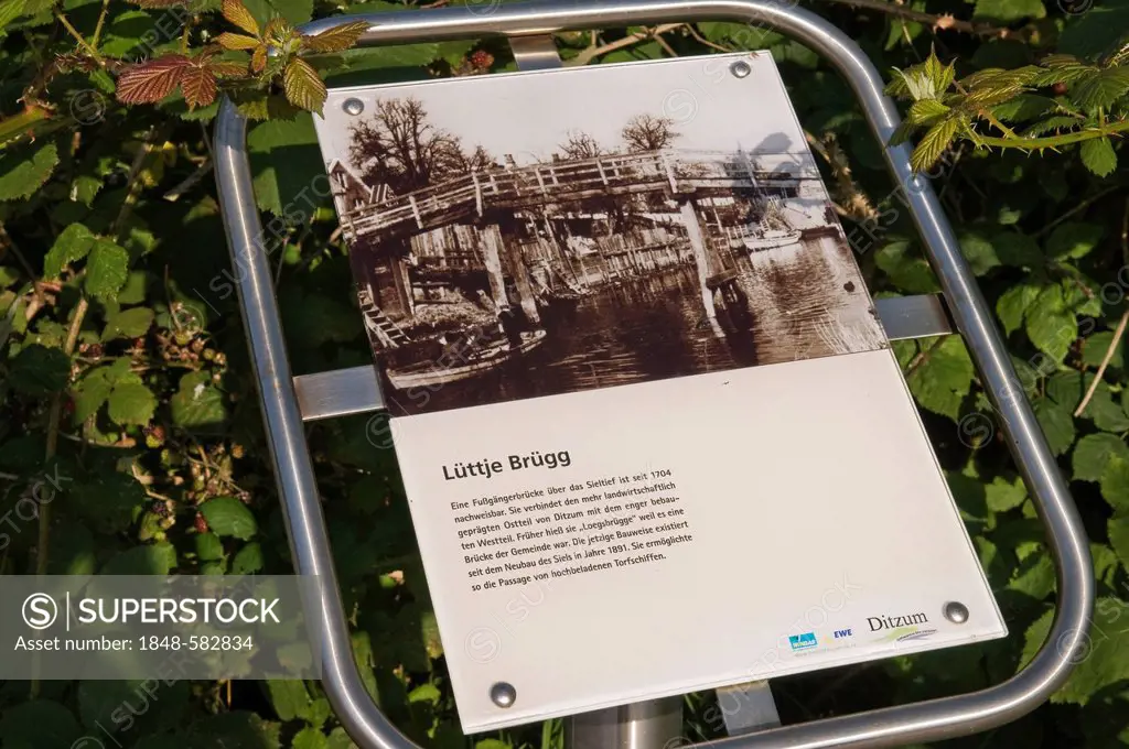 Information panel for Luettje Bruegg, small bridge, boardwark across the tidal outlet, Ditzum, East Frisia, Lower Saxony, Germany, Europe