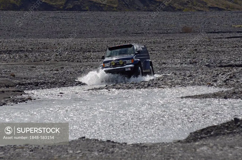 Super jeep driving in the river bed of the Krossá River, Þórsmoerk, Iceland, Europe