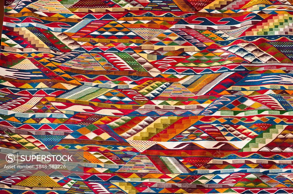Multi-coloured pattern of a woven carpet, Marrakech, Morocco, Africa