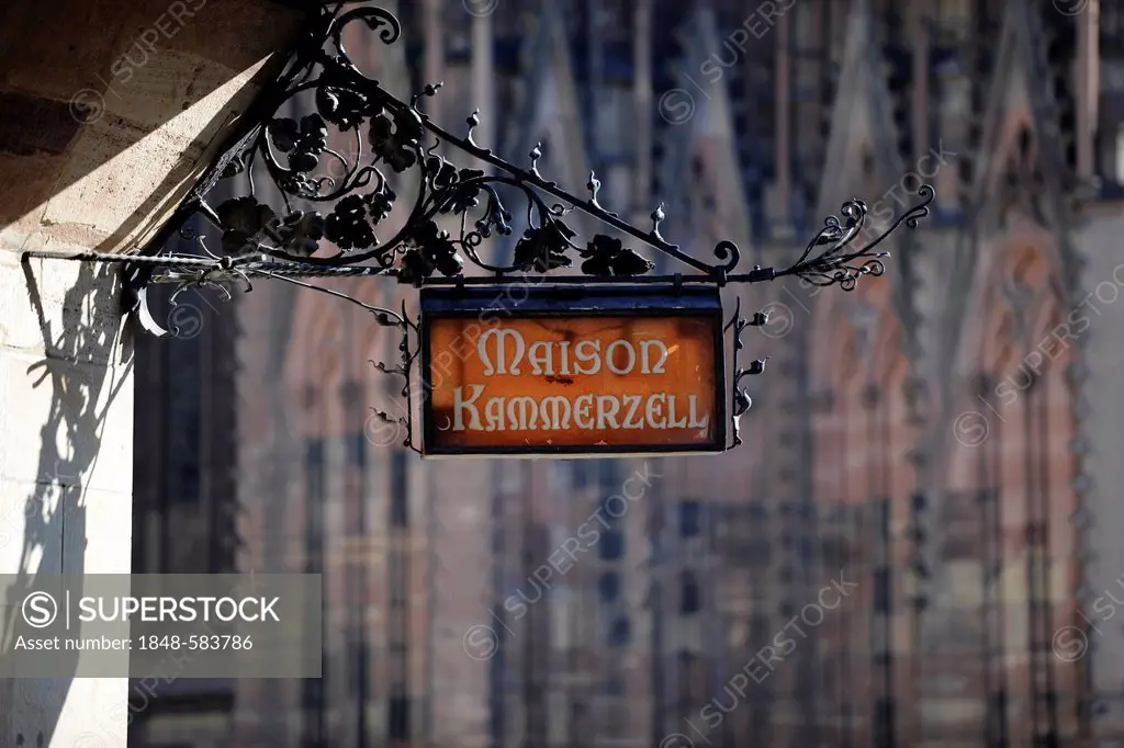 Restaurant sign for Maison Kammerzell, Kammerzell House, the best known secular building in Strasbourg, in front of Strasbourg Cathedral or the Cathed...