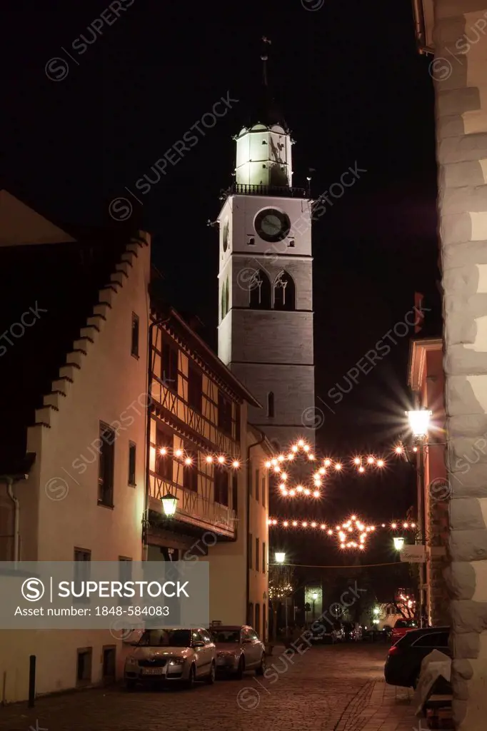 Alleyway decorated with Christmas lights, St. Nikolaus parish church at back, Ueberlingen, Lake Constance district, Baden-Wuerttemberg Germany, Europe