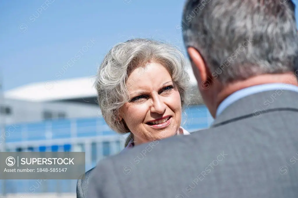 Businesswoman and a businessman having a conversation