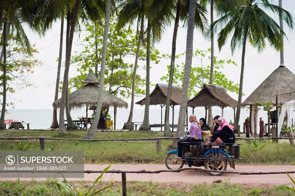 Motorcycle taxi with women on the beach road, Ko Jum or Koh Pu island, Krabi, Thailand, Southeast Asia