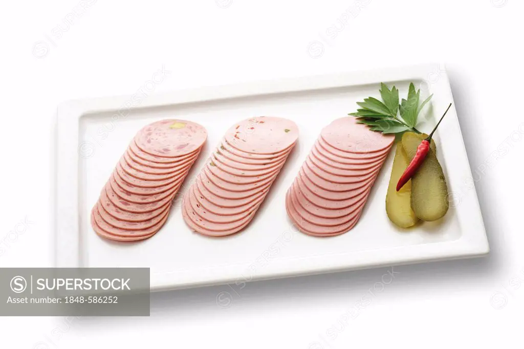 Lyon sausage, ham sausage and Tyrolean sausage slices on a plate