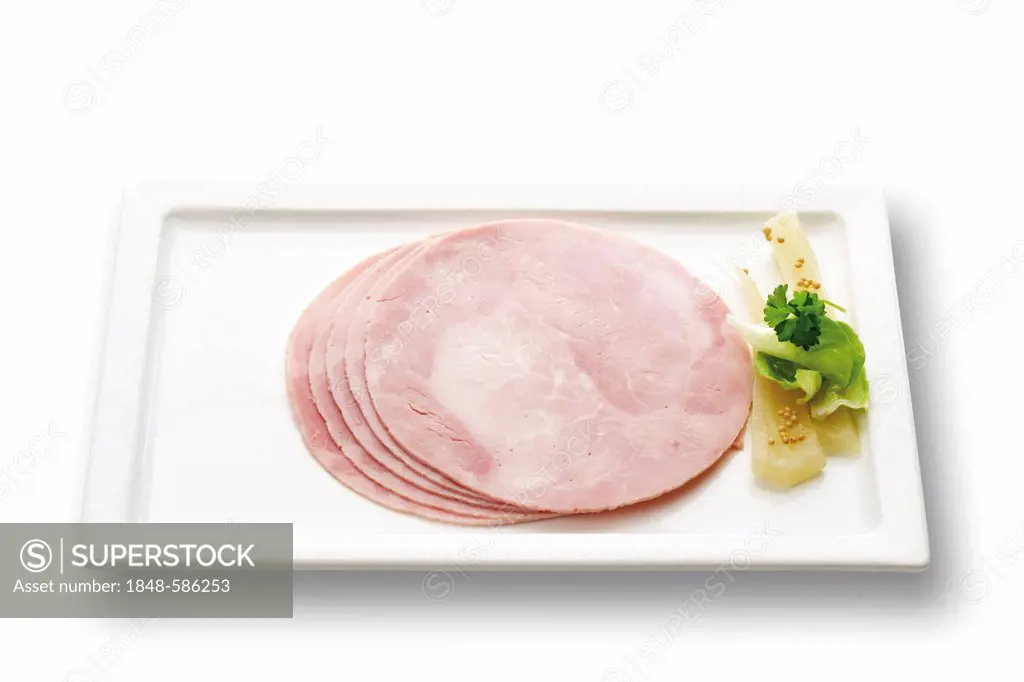 Slices of cooked ham on a plate