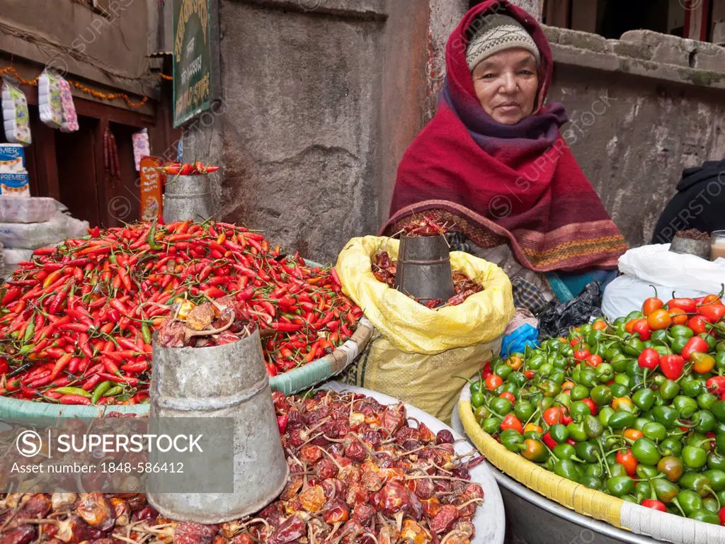 Woman selling vegetables in the streets of Kathmandu, Nepal, South Asia