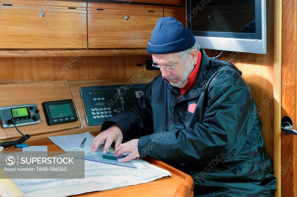 Skipper plotting his course