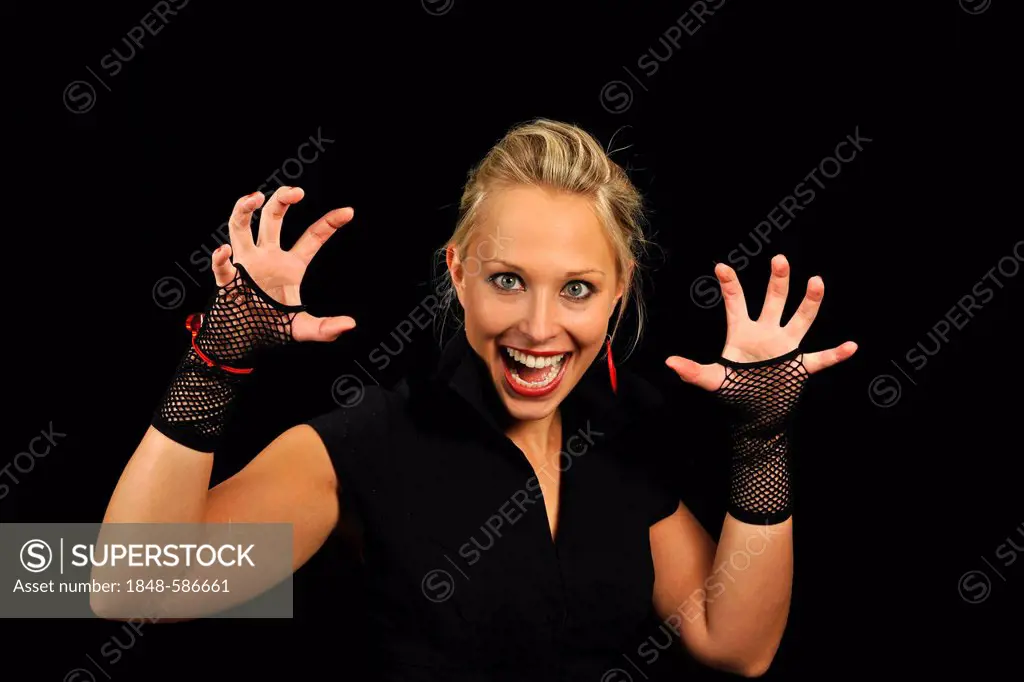 Young woman, vamp, showing her claws, Halloween