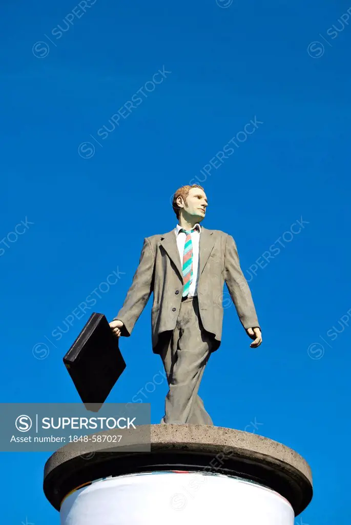 Businessman, sculpture on an advertising column, Duesseldorf, North Rhine-Westphalia, Germany, Europe