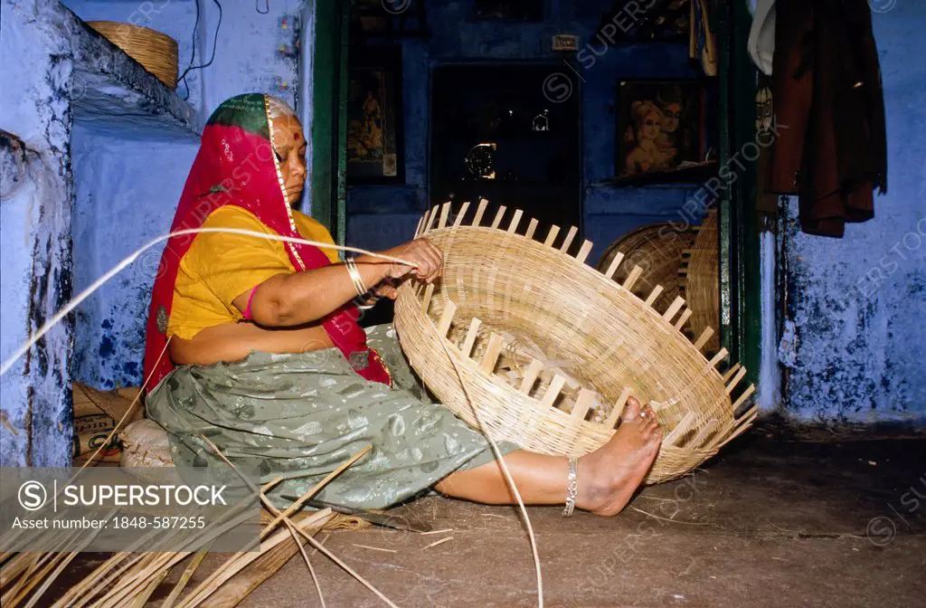 Local woman making basket from bamboo, Jodhpur, Rajasthan, India, Asia
