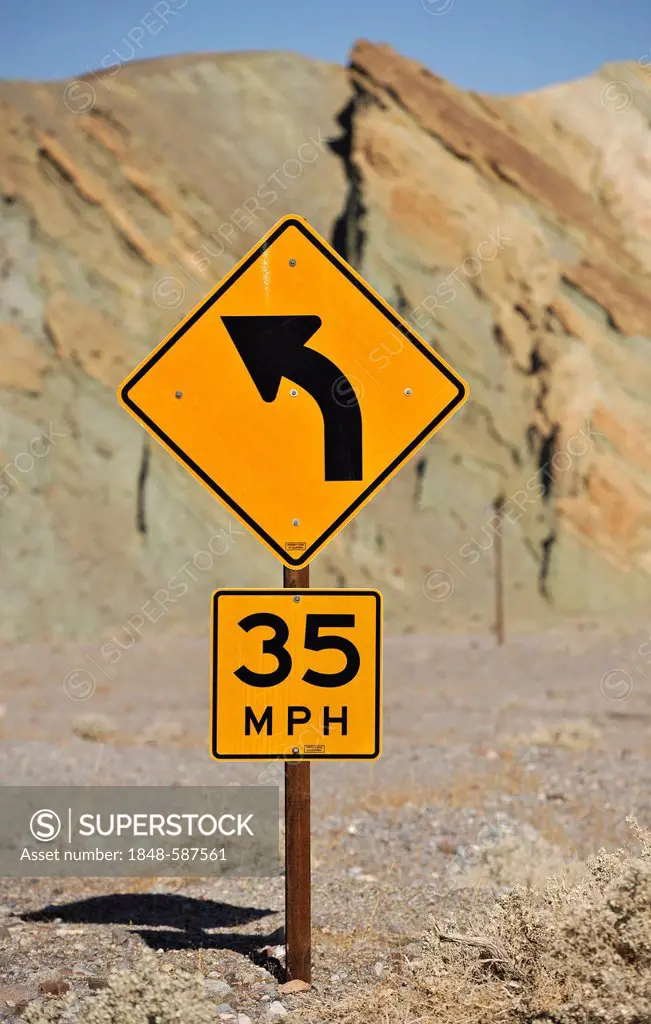 Traffic sign, curve ahead and 35 mph speed limit, Death Valley National Park, Mojave Desert, California, United States of America