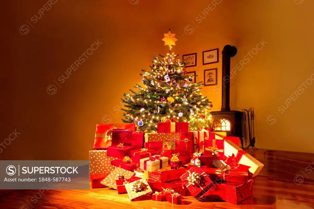 Christmas, little mountain of gifts in front of a Christmas tree