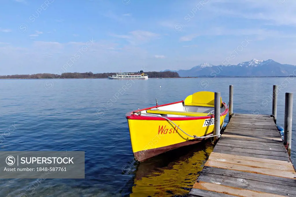 Yellow rowing boat Wastl tied to a jetty, lake Chiemsee, Prien Stock, Chiemgau, Upper Bavaria Germany, Europe