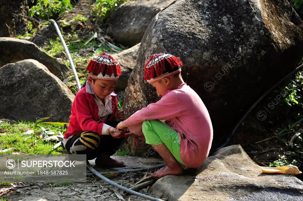 Boys at play, member of the Red Dao ethnic minority, in the countryside near Sa Pa, Northern Vietnam, Vietnam, Southeast Asia, Asia