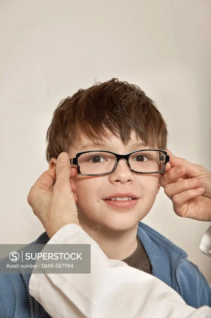 Boy trying on glasses