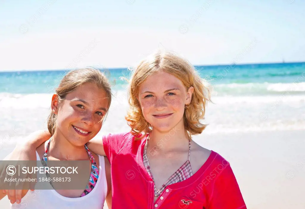Two teenagers on the beach, Camaret-sur-Mer, Finistere, Brittany, France, Europe
