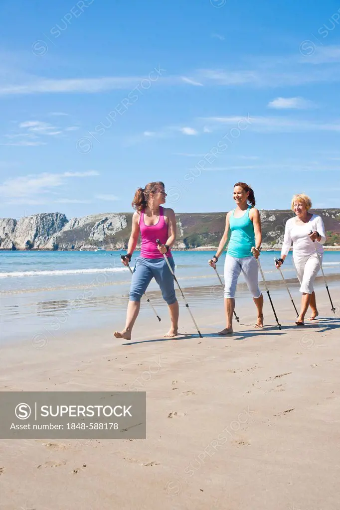 Three women Nordic Walking on the beach, Camaret-sur-Mer, Finistere, Brittany, France, Europe