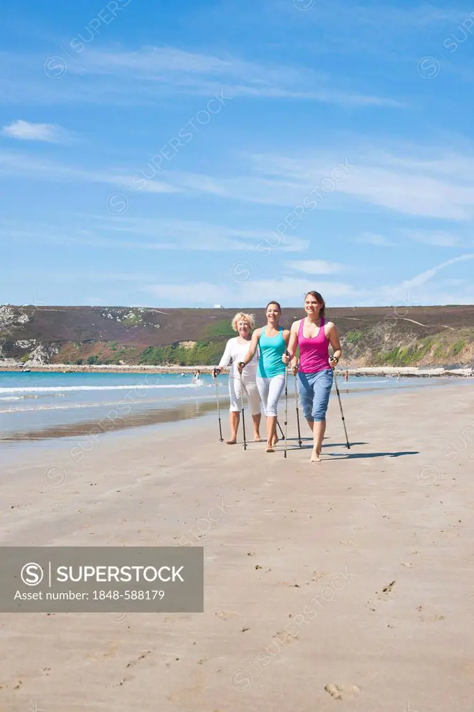 Three women Nordic Walking on the beach, Camaret-sur-Mer, Finistere, Brittany, France, Europe