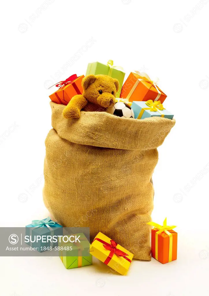 Jute bag full of gifts, teddy bear, football