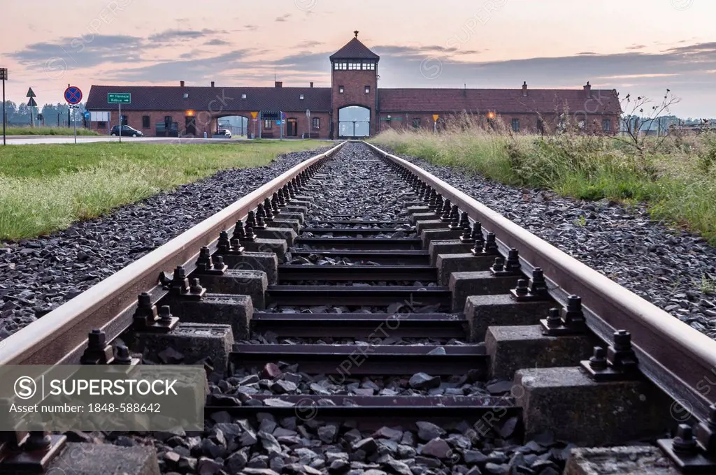 Rail tracks and entrance gate to the Auschwitz-Birkenau concentration camp, Auschwitz, Lesser Poland, Poland, Europe