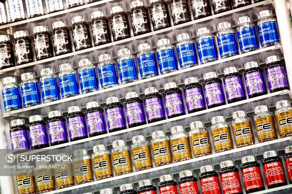 A shelf of nutritional supplements for muscle growth, bodybuilding, FIBO Power 2012 fitness fair, Essen, North Rhine-Westphalia, Germany, Europe