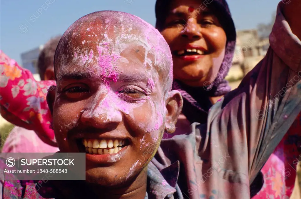 Visitors of the Holi festival, sprayed with colour powder and water, Vrindaban, Uttar Pradesh, India, Asia