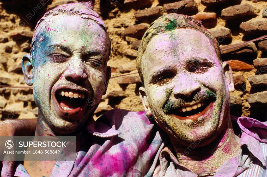 Visitors of the Holi festival, sprayed with colour powder and water, Vrindaban, Uttar Pradesh, India, Asia
