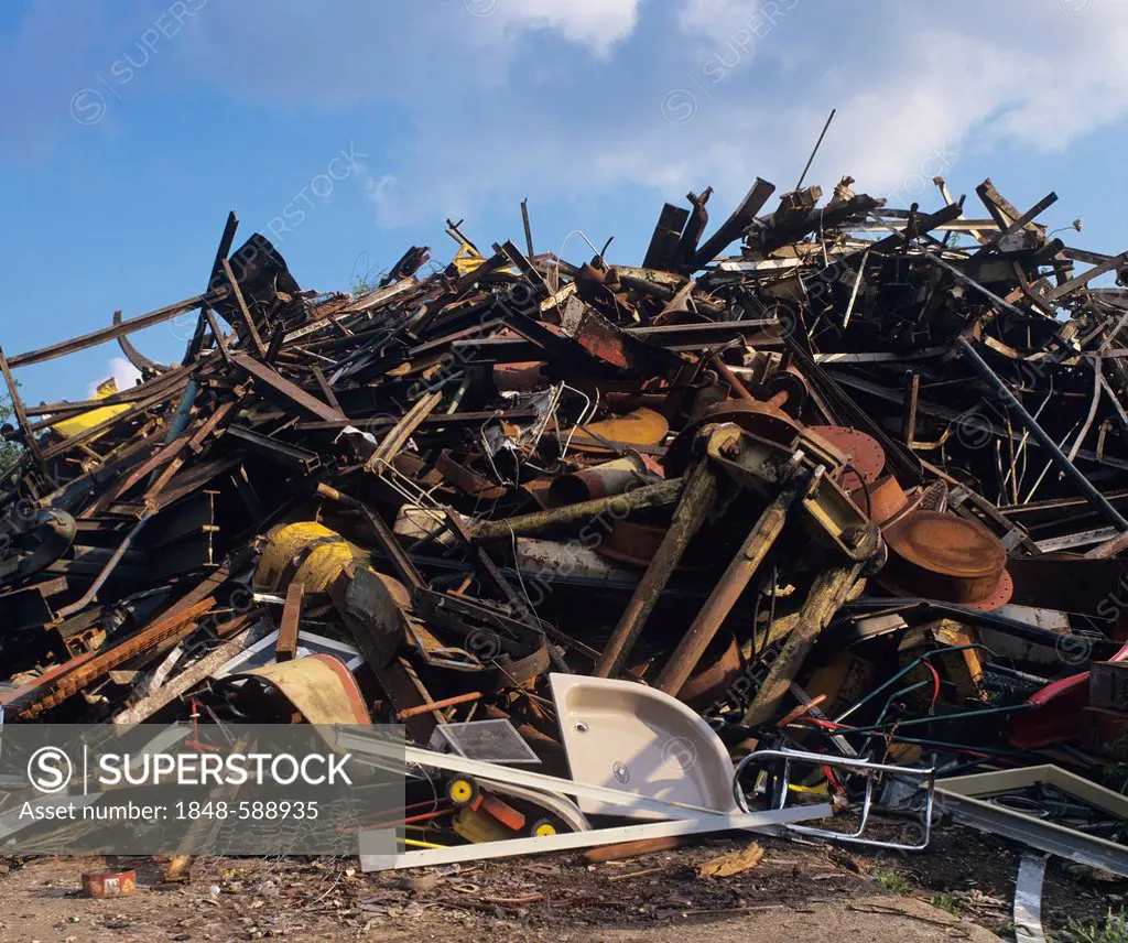 Heap of scrap metal at a waste yard, waste separation, recycling