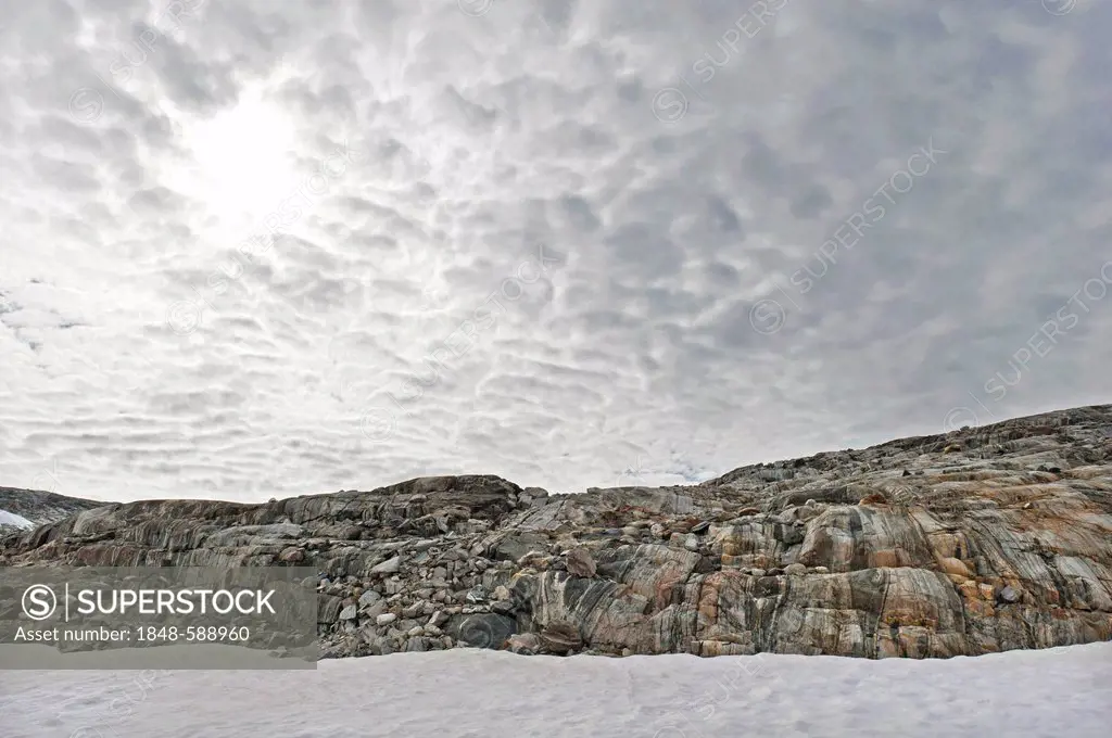 Rocks and cloudy sky, Mittivakkat Glacier, Ammassalik Island, East Greenland