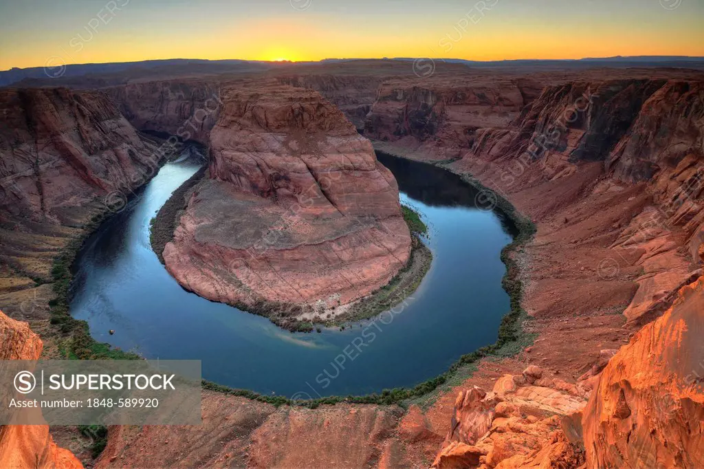 Horseshoe Bend or King Bend, a meandering bend of the Colorado River, at sunset, Page, Glen Canyon National Recreation Area, Arizona, United States of...