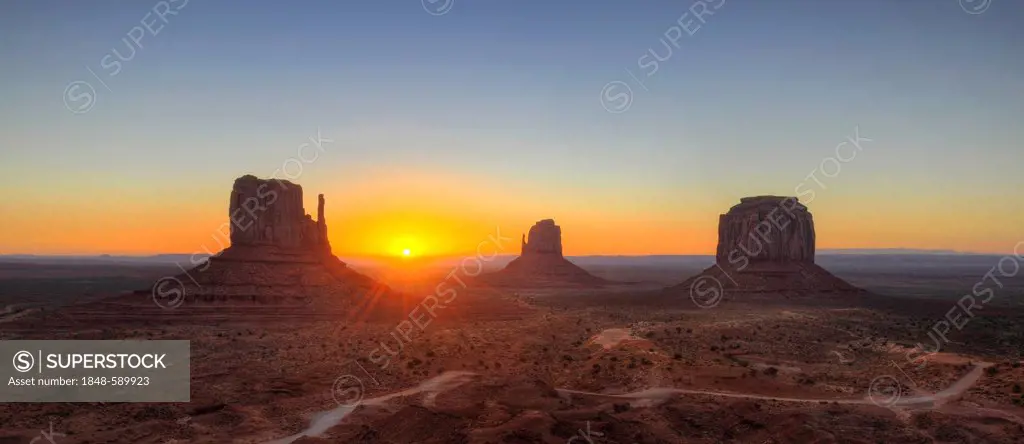 Sunrise behind mesas, West Mitten Butte, East Mitten Butte, Merrick Butte, Scenic Drive, Monument Valley, Navajo Tribal Park, Navajo Nation Reservatio...
