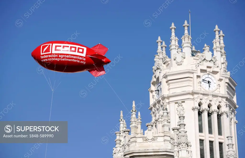 Gas-filled zeppelin during the general strike against cuts in social services in front of the Palacio Nuestra Señora de Correos or Palacio de Comunica...