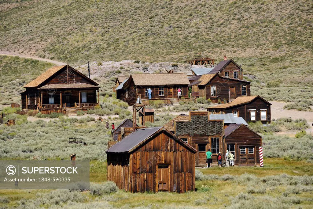 Tourists in the ghost town of Bodie, a former gold mining town, Bodie State Historic Park, California, United States of America, USA