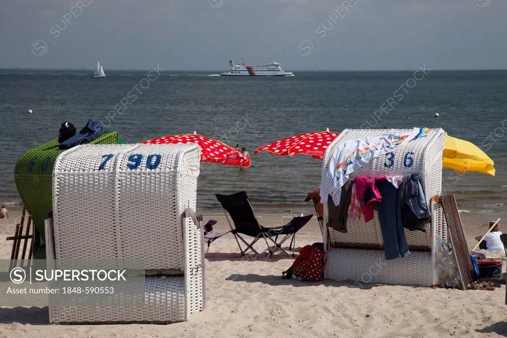 Beach chairs on the beach and a ferry, Wyk auf Foehr, Foehr Island, North Sea, North Frisia, Schleswig-Holstein, Germany, Europe