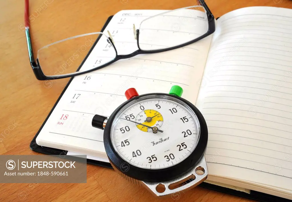 Stopwatch, calendar and a pair of glasses