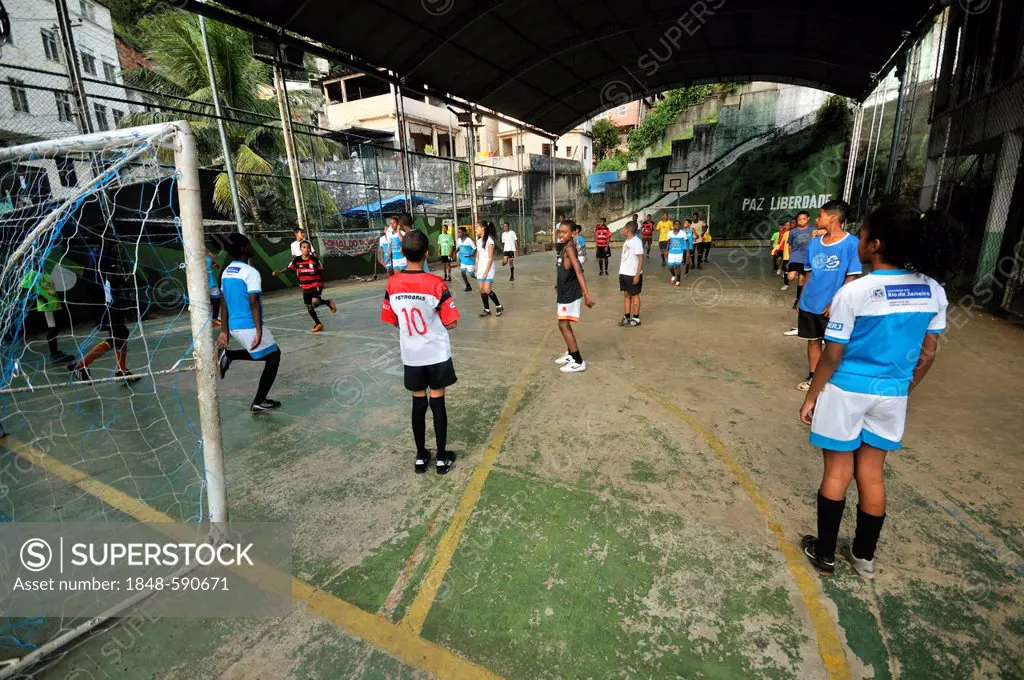 Soccer training on a sports field, Favela Morro da Formiga slum, Tijuca district, Rio de Janeiro, Brazil, South America