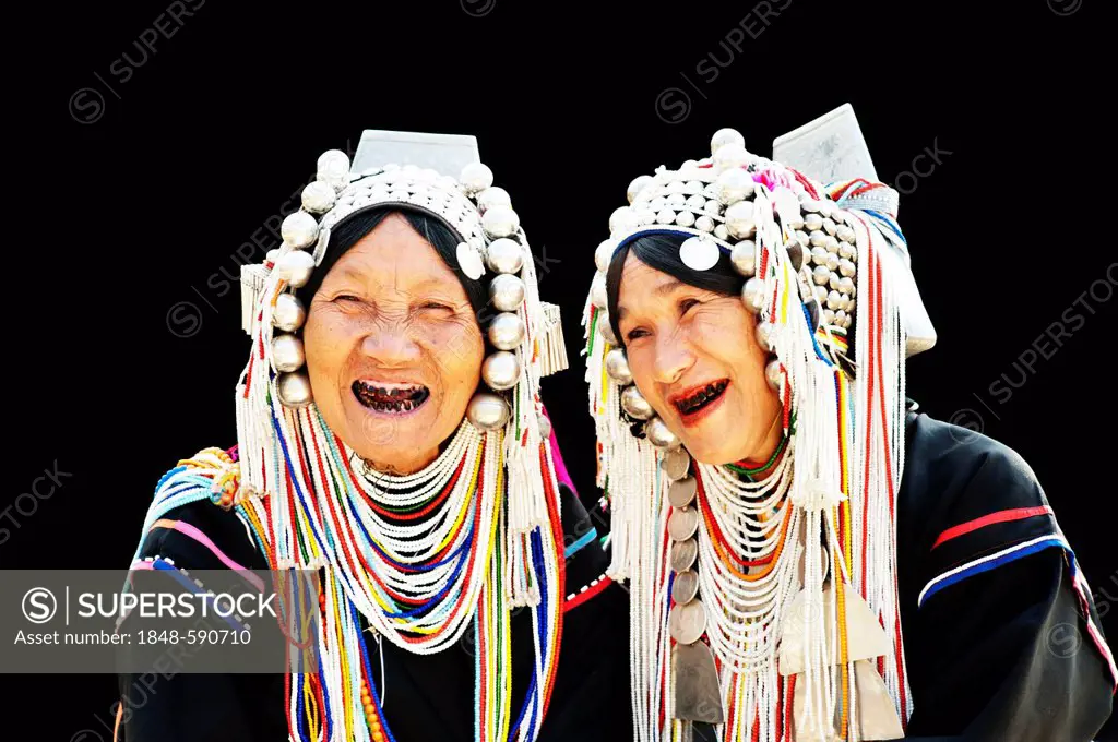 Portrait of two Akha hill tribe women wearing the traditional LomueAkha costume, in Chiang Rai, Thailand, Asia