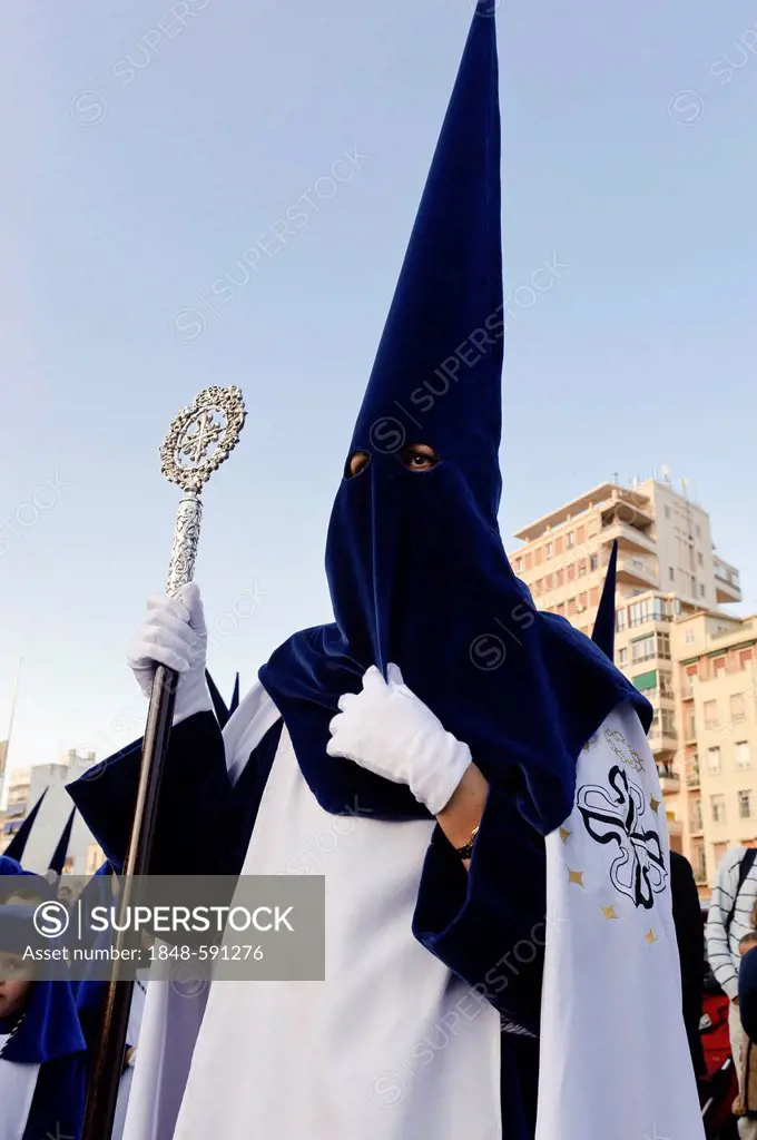 Penitent at procession during the Semana Santa, Holy Week, in Malaga, Andalucia, Spain, Europe
