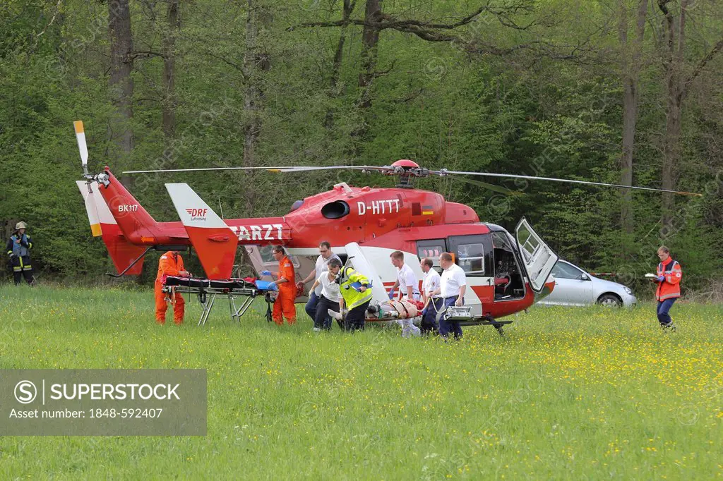 Rescue helicopter in action after aircraft crash in a wooded area at Hahnweide, Kirchheim unter Teck, Baden-Wuerttemberg, Germany, Europe