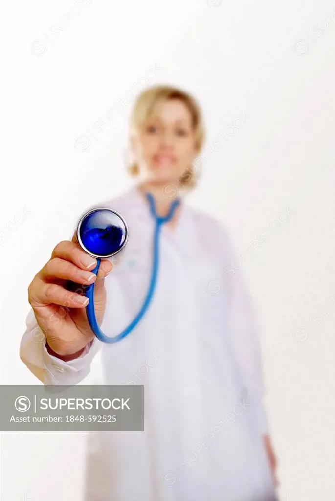 Female doctor, 30-40 years, holding a stethoscope to the front