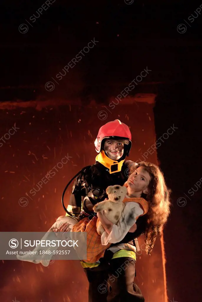 Firefighter rescuing a girl from a burning building