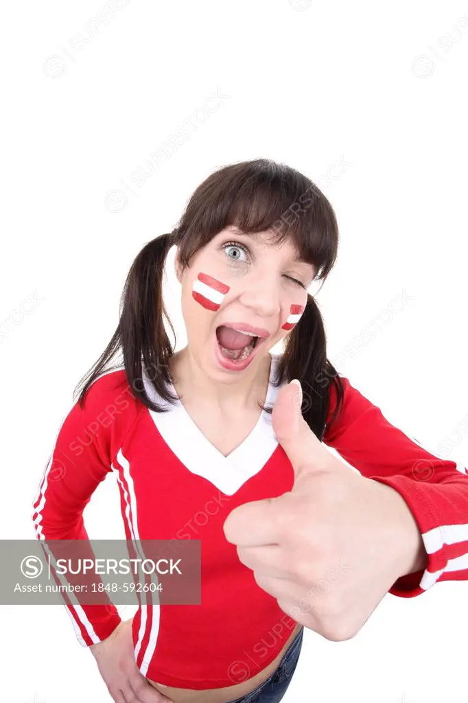 Young woman, football fan with a painted face, Austrian national flag, thumbs up