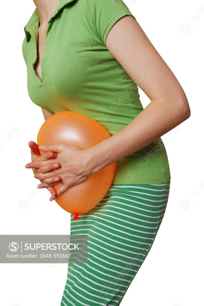 Woman pushing a balloon against her belly, symbolic image for abdominal cramps, abdominal pain, indigestion, irritable bowel, PMS, food intolerance, b...